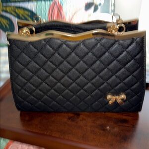 Black Quilted Women's Chain Shoulder Bag with Gold Bow Accent